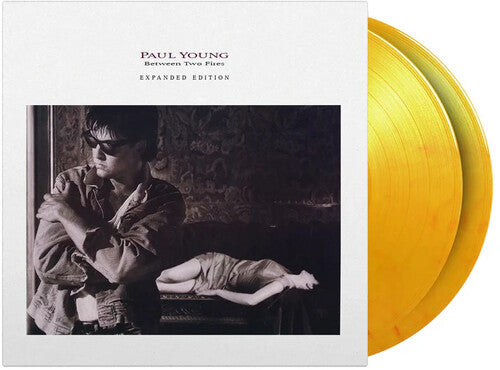 Paul Young: Between Two Fires - Limited & Expanded 180-Gram Flame Colored Vinyl ( RECORD )